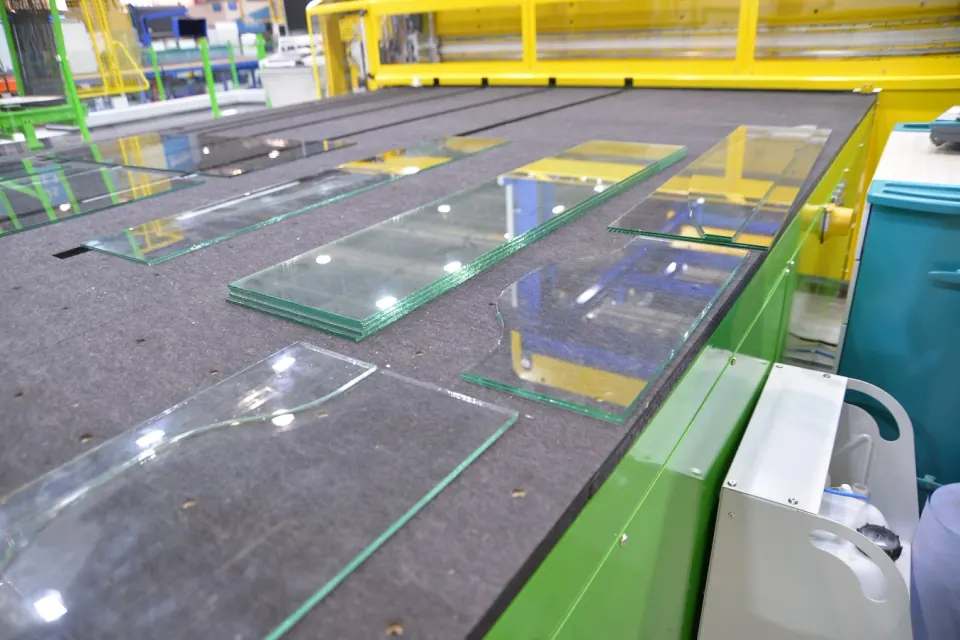 Laminated glass sheets processed with laser-assisted interlayer cutting.